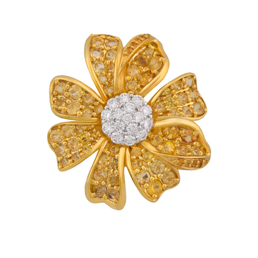 Gold flower-shaped jewelry with a central diamond on a white background