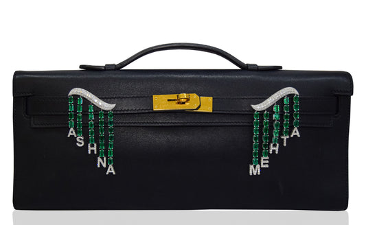 Black suitcase with decorative handles and text on a white background, collection-preview