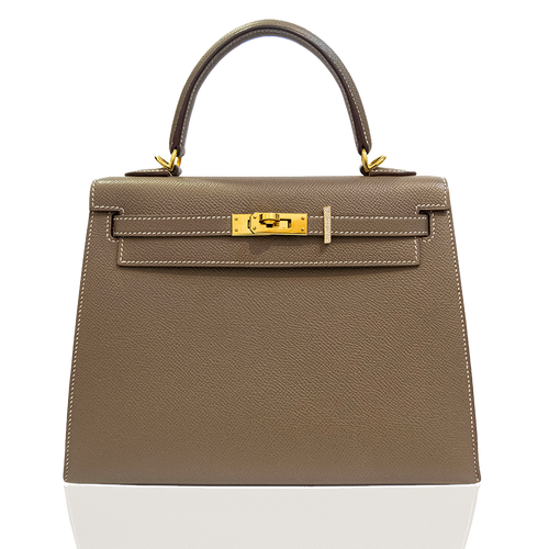 Beige handbag with gold hardware on a white background, collection-preview