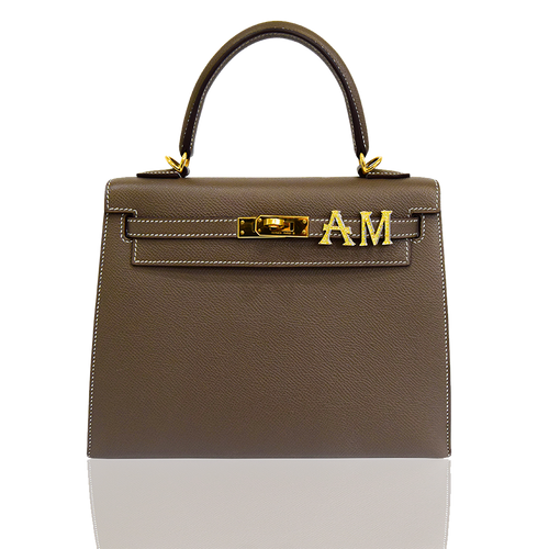 Brown handbag with gold hardware on a white background, collection-preview