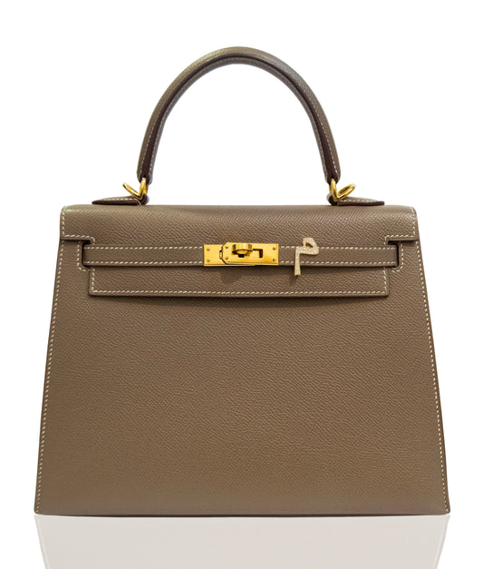 Brown handbag with gold hardware on a white background, collection-preview