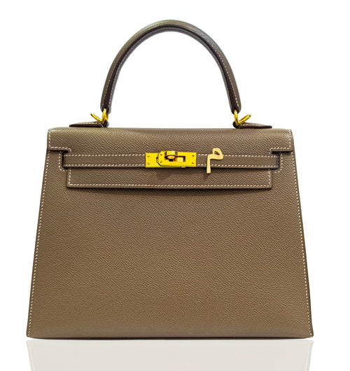 Brown handbag with gold hardware on a white background, collection-preview