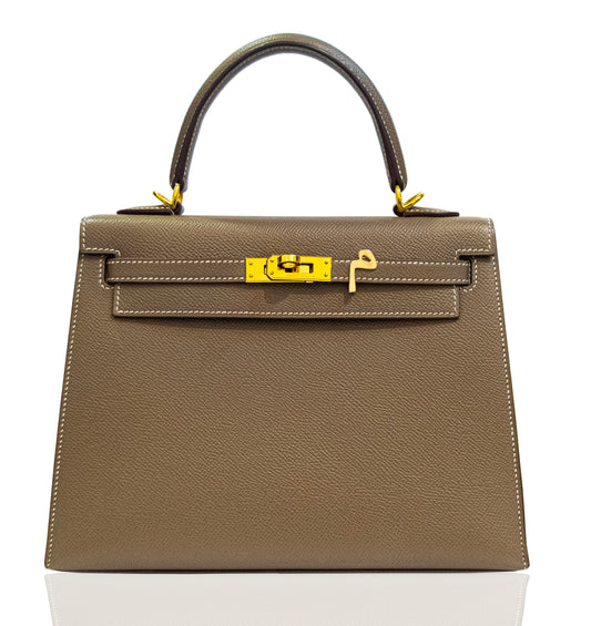 Brown handbag with gold hardware on a white background, collection-preview
