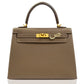 Brown handbag with gold hardware on a white background, collection-preview