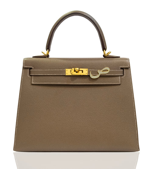 Brown handbag with gold hardware on a white background, collection-preview