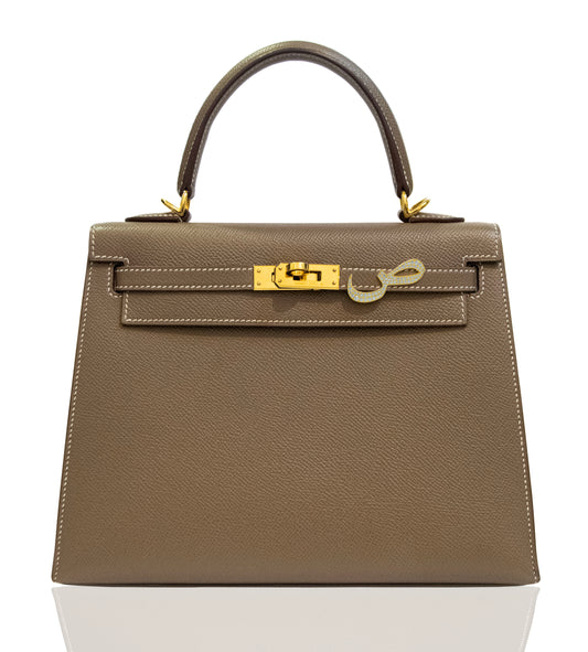 Brown handbag with gold hardware on a white background, collection-preview