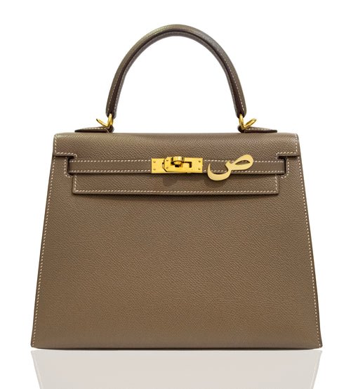 Brown handbag with gold hardware on a white background, collection-preview