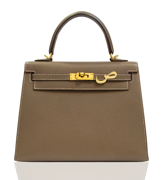 Brown handbag with gold hardware on a white background, collection-preview