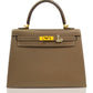 Brown handbag with gold hardware on a white background, collection-preview