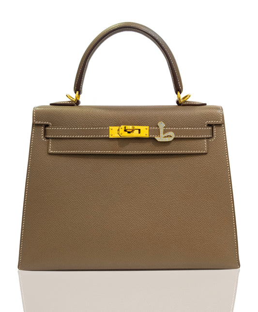 Brown handbag with gold hardware on a white background, collection-preview