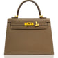 Brown handbag with gold hardware on a white background, collection-preview