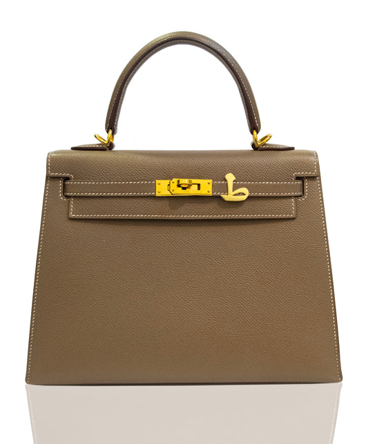 Brown handbag with gold hardware on a white background, collection-preview
