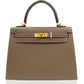 Brown handbag with gold hardware on a white background, collection-preview