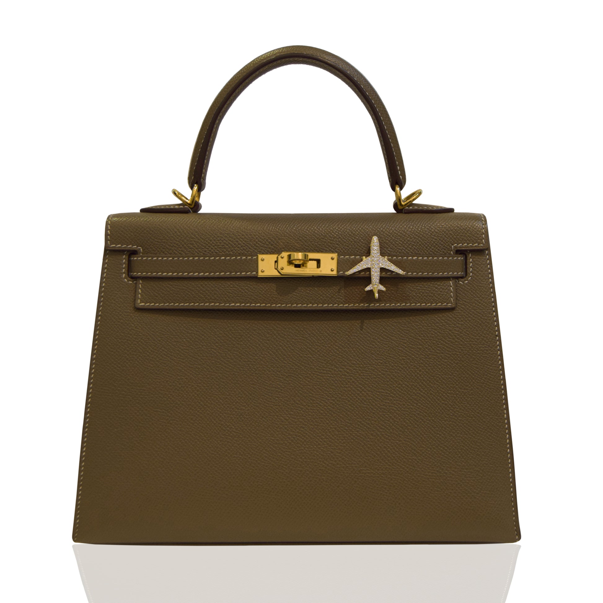 Brown handbag with gold hardware on a white background, collection-preview