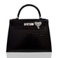Black textured handbag with a silver clasp on a white background, collection-preview