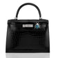 Black crocodile skin handbag with silver hardware and a decorative beetle pin on a white background, collection-preview