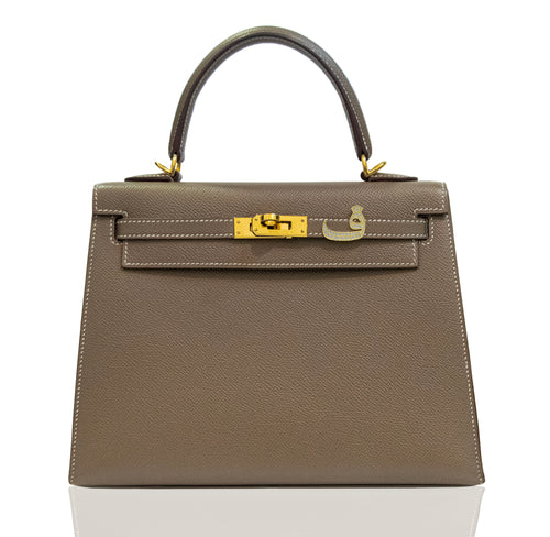 Brown handbag with gold hardware on a white background, collection-preview