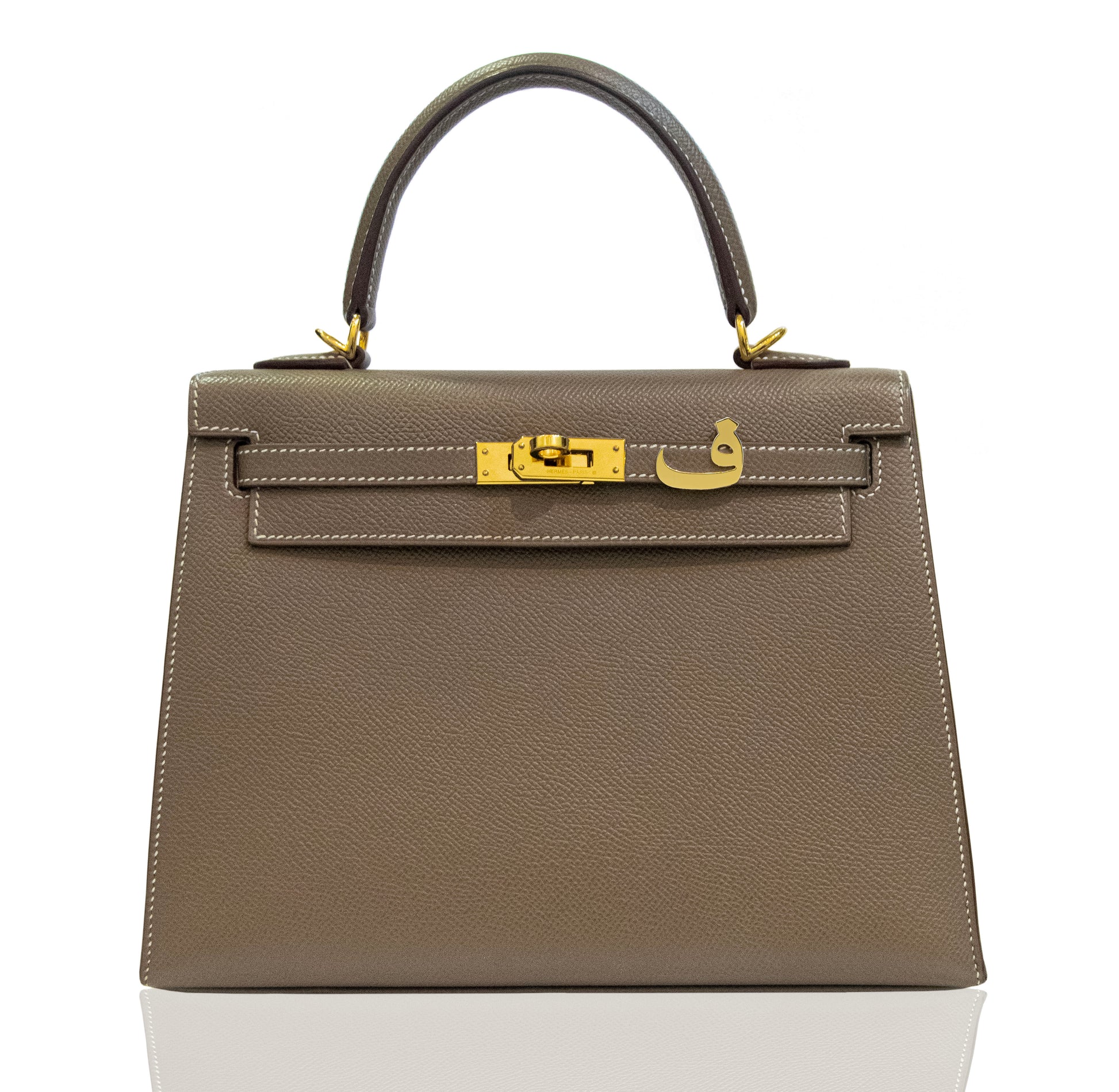 Brown handbag with gold hardware on a white background, collection-preview