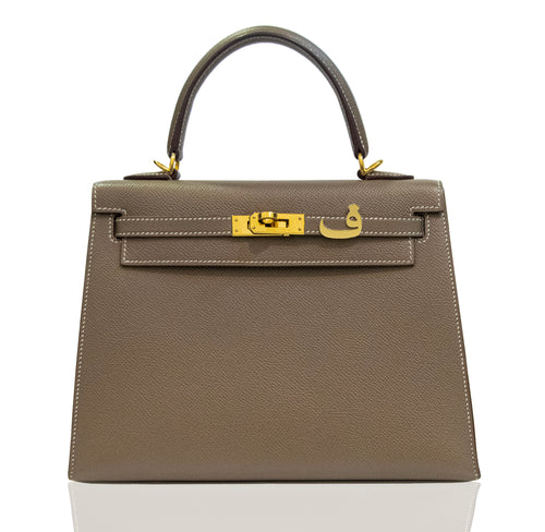 Brown handbag with gold hardware on a white background, collection-preview