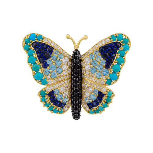 Butterfly-shaped jewelry with blue, black, and gold colors on a white background