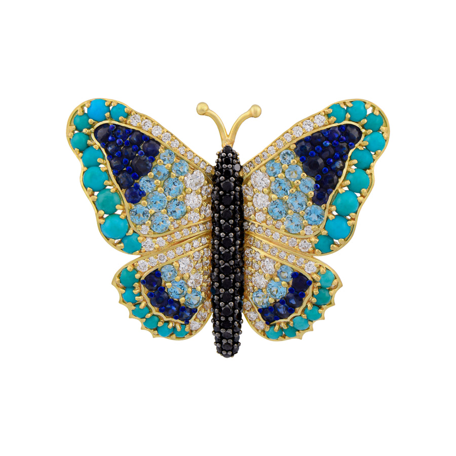 Butterfly-shaped jewelry with blue, black, and gold colors on a white background