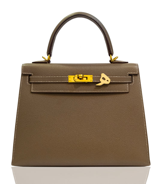 Brown handbag with gold hardware on a white background, collection-preview