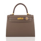 Brown handbag with gold hardware and a decorative clasp on a white background, collection-preview