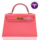 Pink handbag with gold hardware on a white background, collection-preview