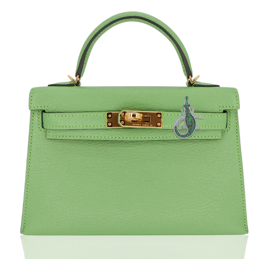Green handbag with gold hardware on a white background, collection-preview