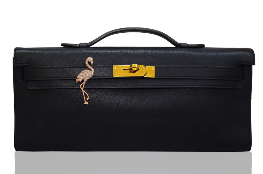 Black leather briefcase with gold clasp and flamingo decoration on a white background, collection-preview.