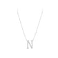 Silver necklace with a 'N' pendant on a white background