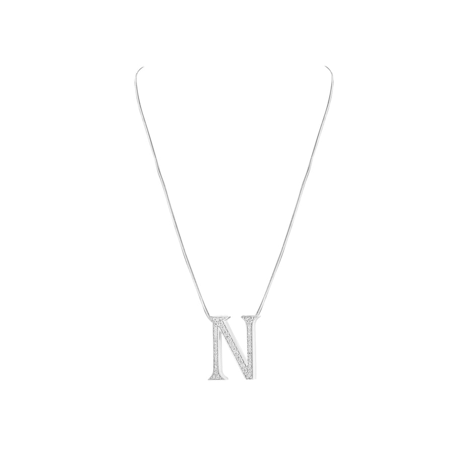 Silver necklace with a 'N' pendant on a white background