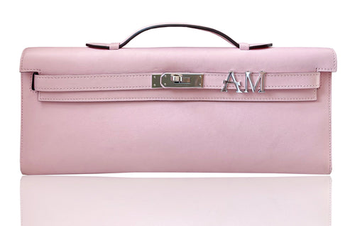 Pink handbag with a visible brand logo on a white background, collection-preview