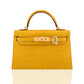 Yellow crocodile-patterned handbag with a gold clasp on a white background, collection-preview