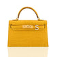 Yellow handbag with gold hardware on a white background, collection-preview