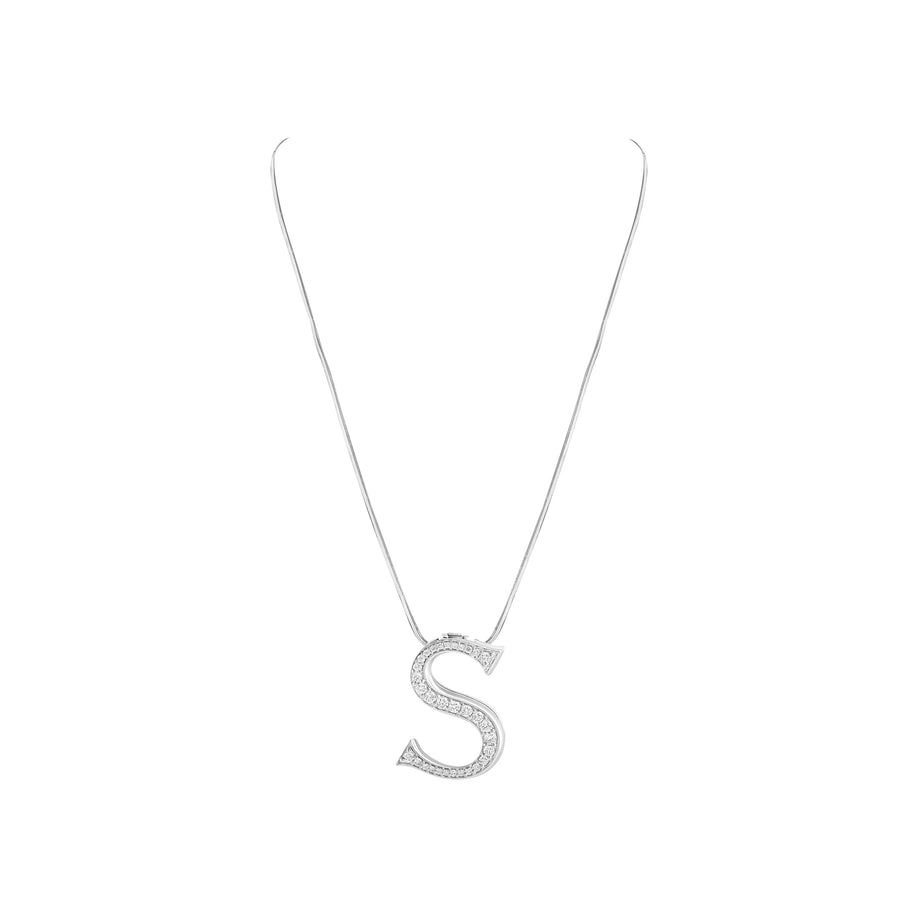 Silver necklace with a letter 'S' pendant on a white background