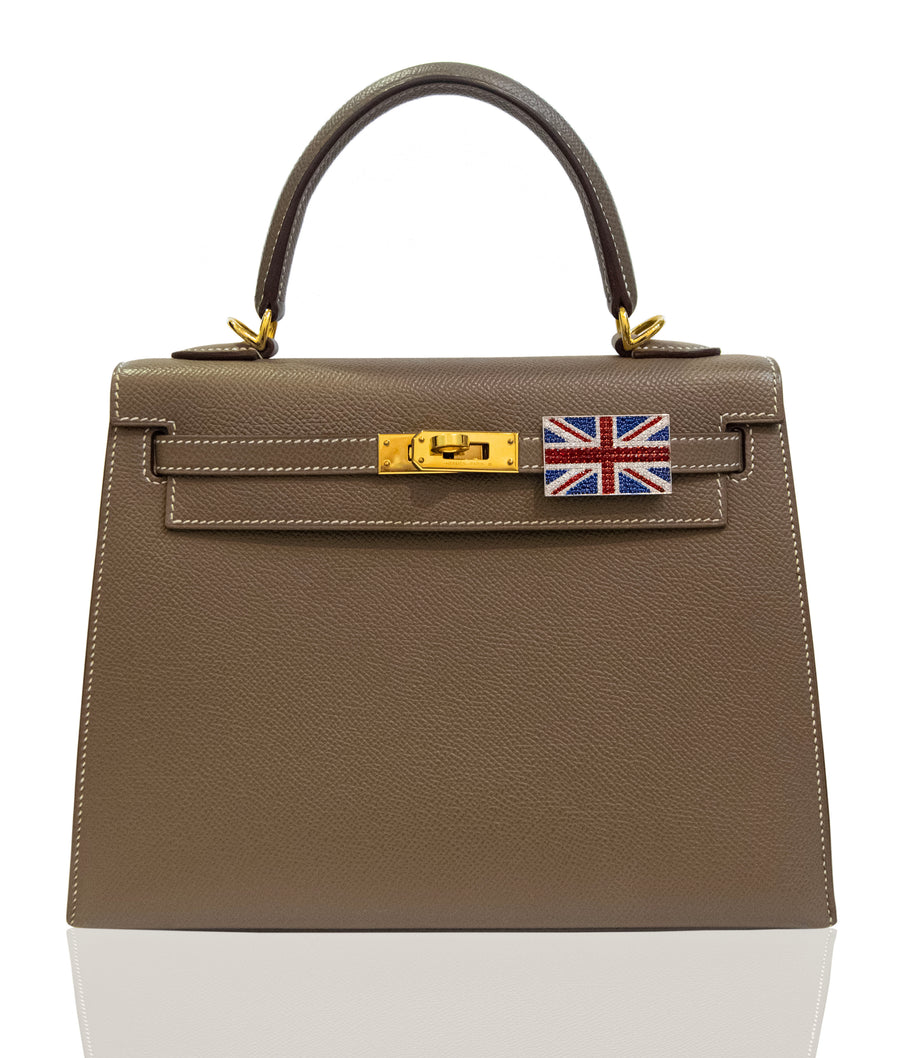 Brown handbag with a gold clasp and Union Jack flag on a white background, collection-preview