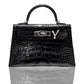 A black handbag with a crocodile pattern and a natural diamond-encrusted 'Y' letter set in a metallic clasp, collection-preview.