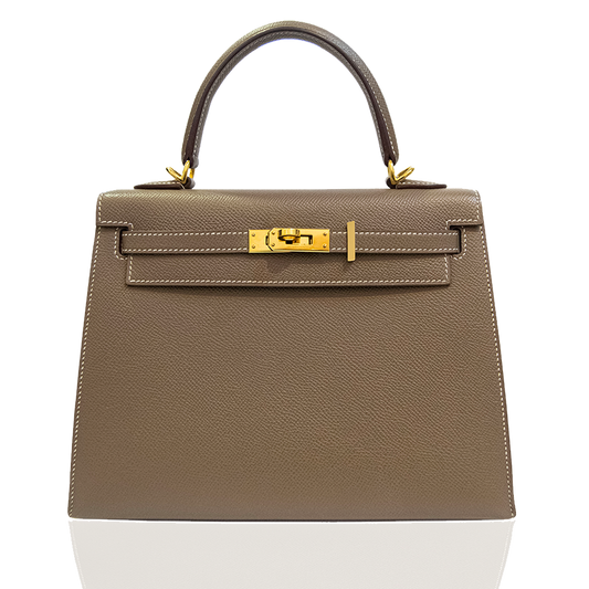 Beige handbag with gold hardware on a white background, collection-preview
