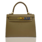 Brown handbag with gold hardware and blue letters on a white background, collection-preview