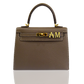 Brown handbag with gold hardware on a white background, collection-preview
