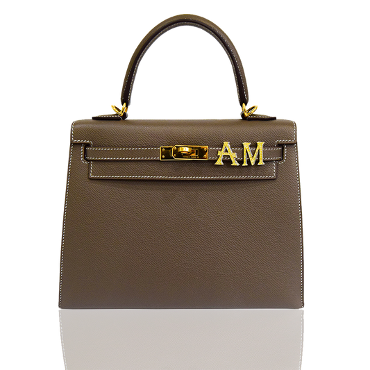 Brown handbag with gold hardware on a white background, collection-preview