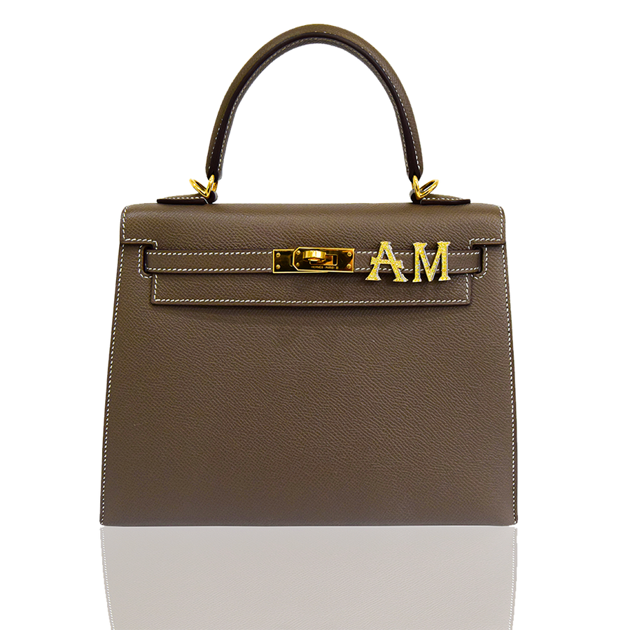 Brown handbag with gold hardware on a white background, collection-preview