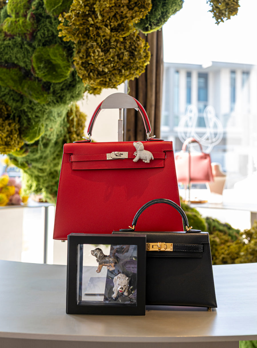 Red and black Kelly bags