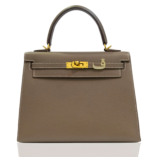 Brown handbag with gold hardware on a white background, collection-preview