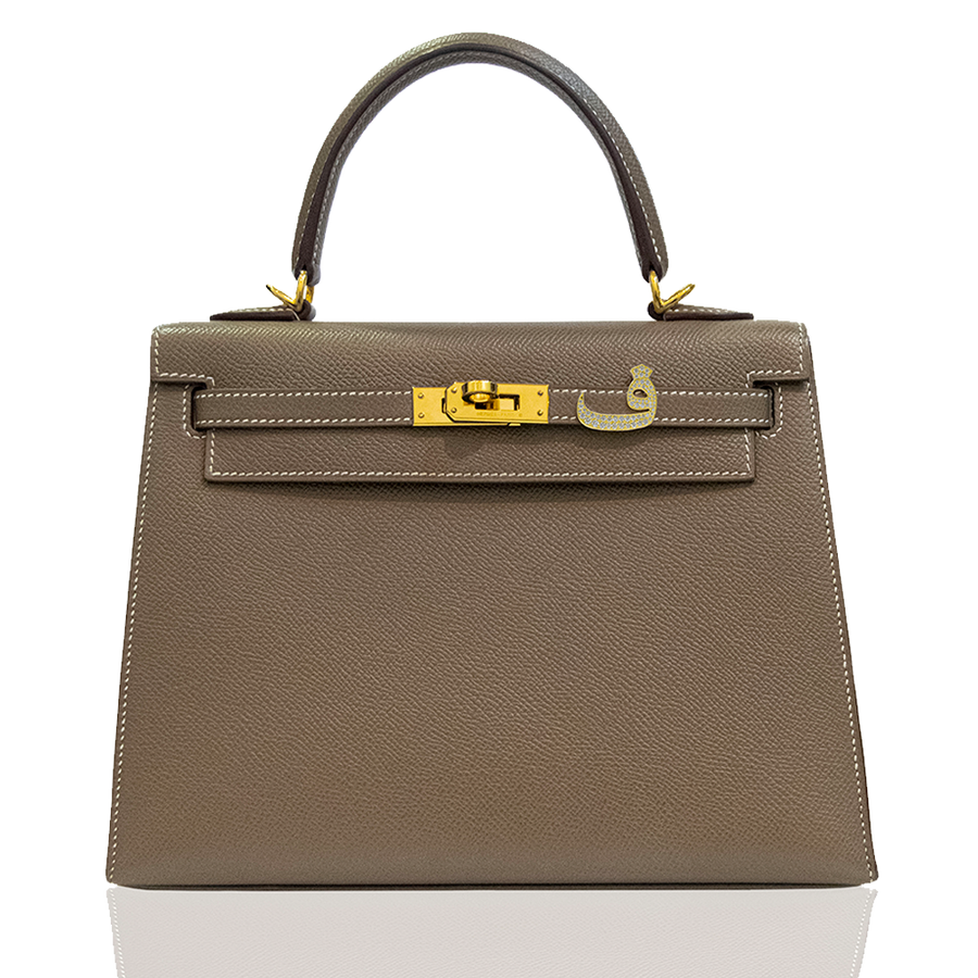 Brown handbag with gold hardware on a white background, collection-preview
