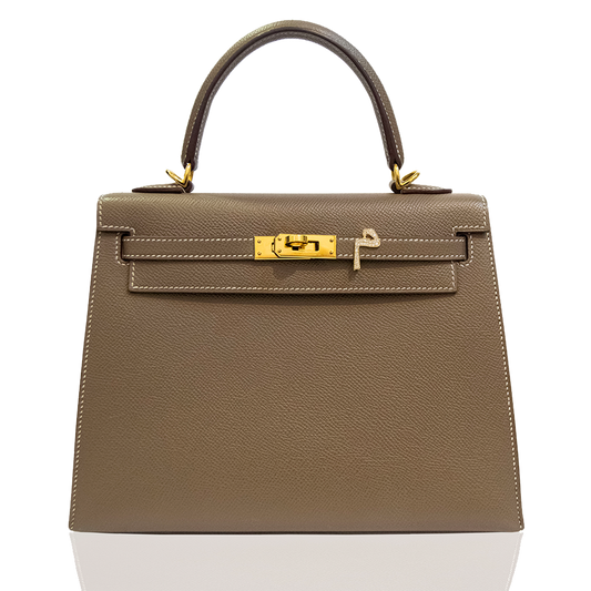 Brown handbag with gold hardware on a white background, collection-preview