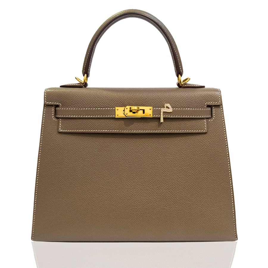 Brown handbag with gold hardware on a white background, collection-preview