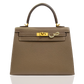 Brown handbag with gold hardware on a white background, collection-preview