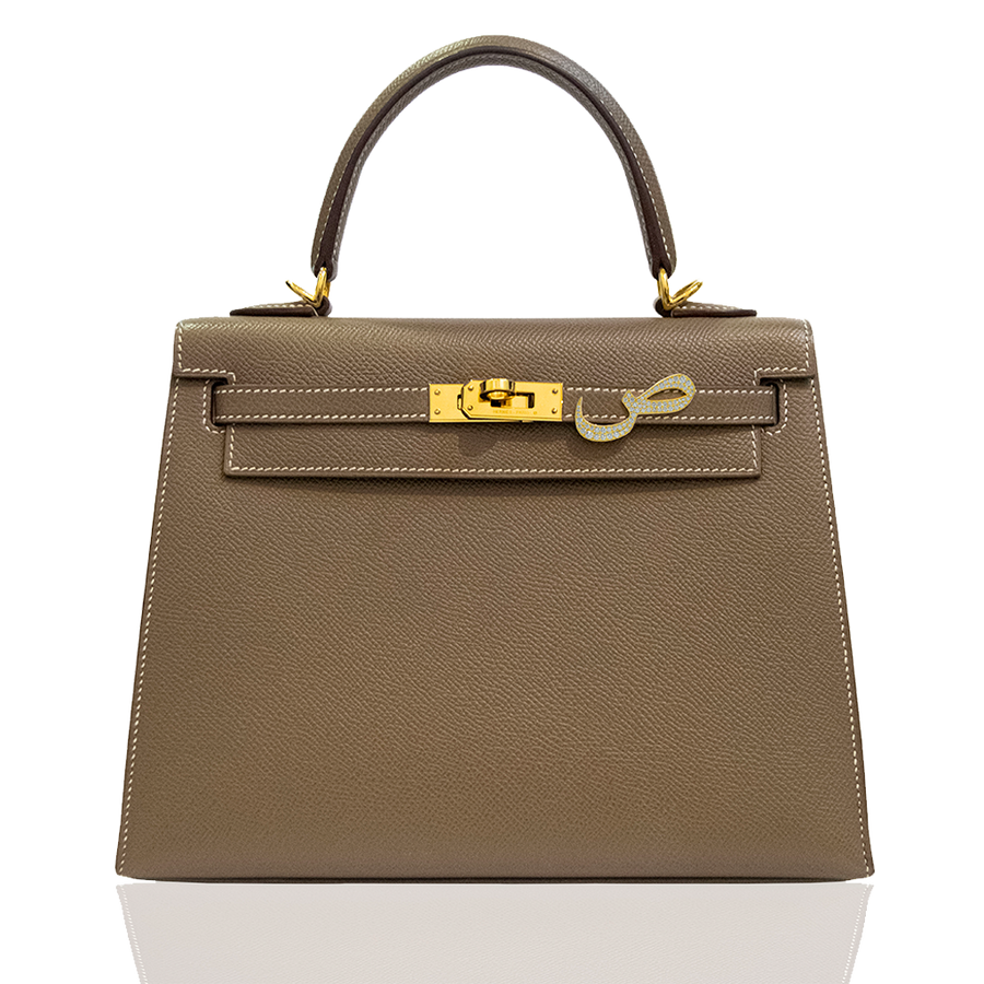 Brown handbag with gold hardware on a white background, collection-preview